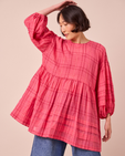 model wears nina hot pink cotton gauze dress