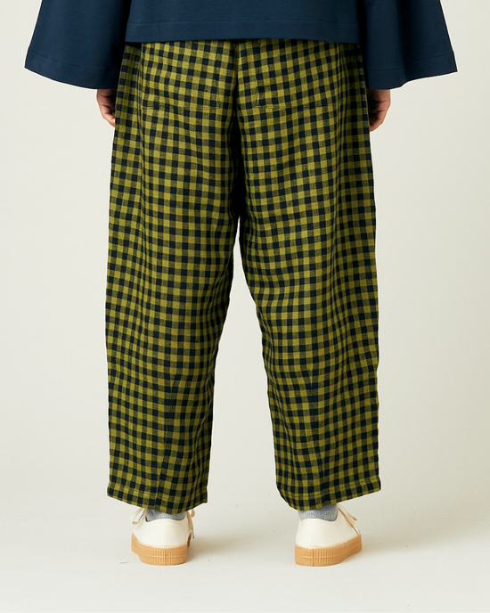 model wears green gingham huxley trousers back