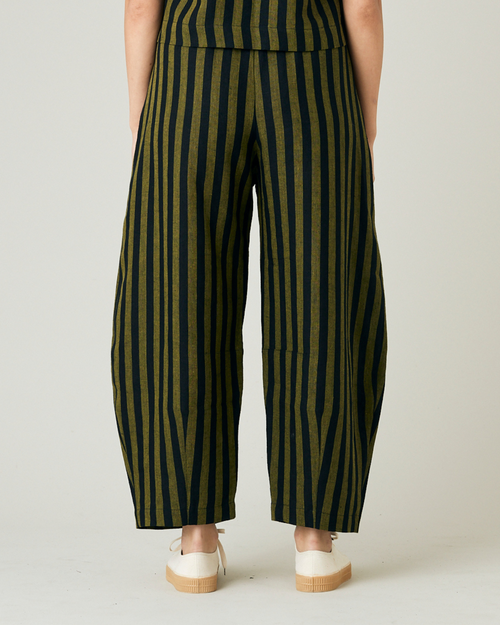 model wears black and olive stripe daisy trousers back