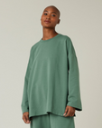 model wears dusty green huxley top