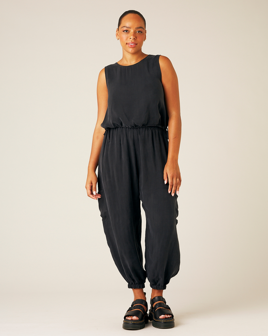 model wears black cupro yoli trousers