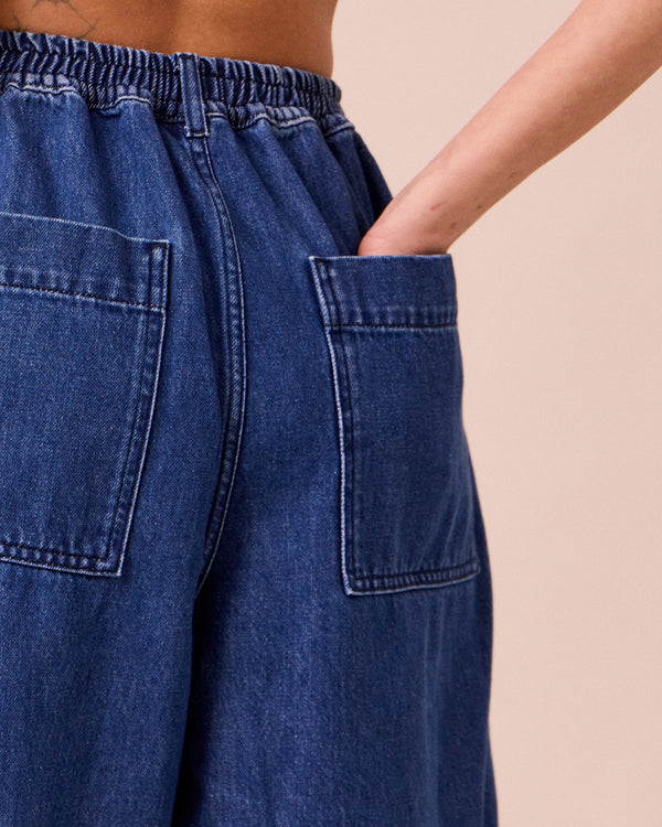 model wears vedamid blue denim jeans