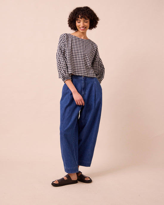 model wears veda mid blue denim jeans right