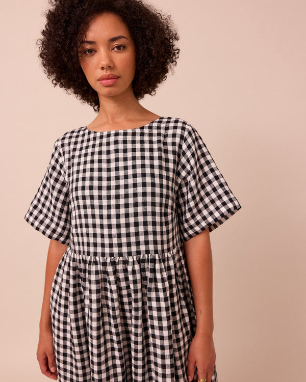 model wears verona black and white linen dress