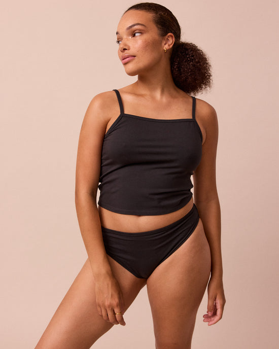 model wears black jersey vest