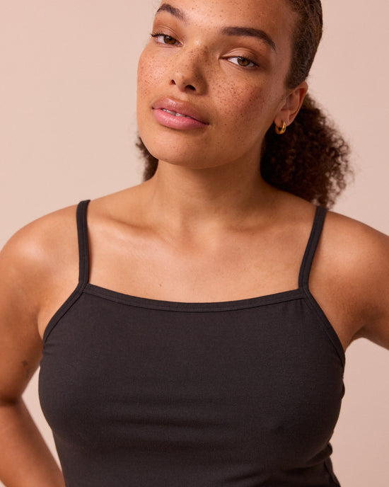 model wears black jersey vest