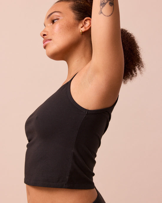 model wears black jersey vest