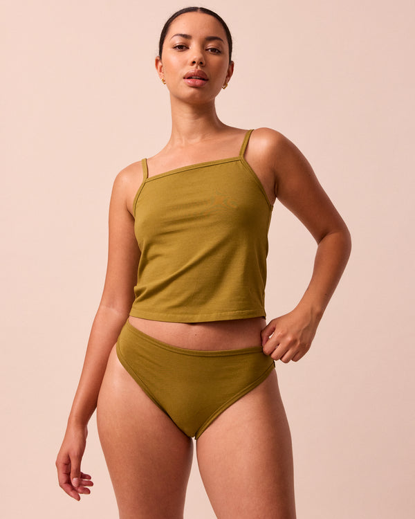 model wears golden olive jersey vest top