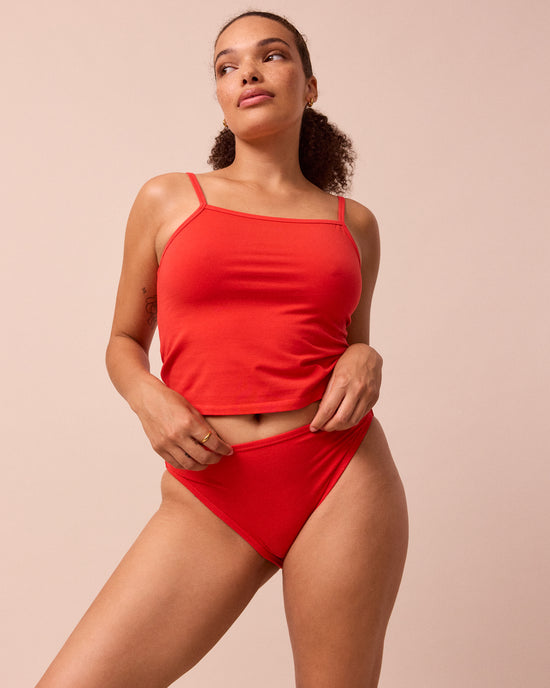 model wears tomato red high rise jersey knicker