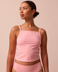 model wears petal pink jersey vest top