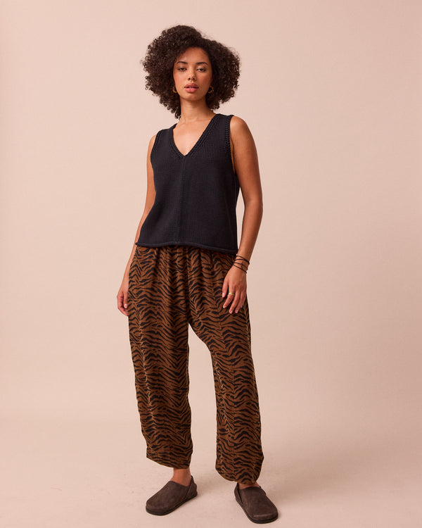 model wears vita black knitted vest