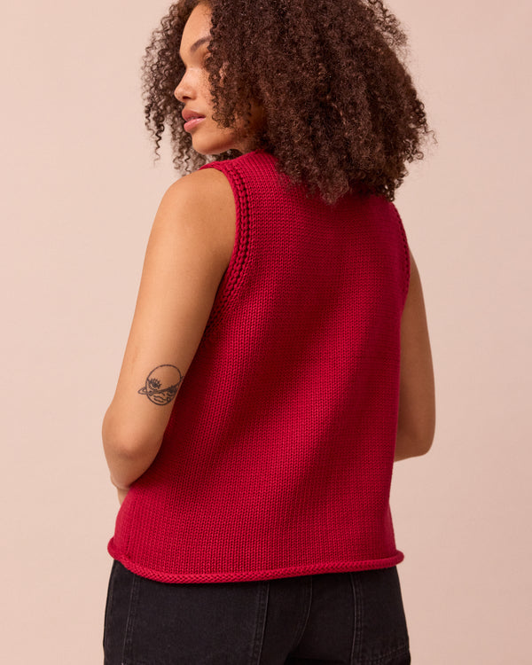 model wears vita cranberry knitted vest