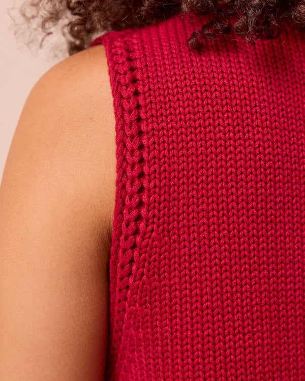 model wears vita cranberry knitted vest