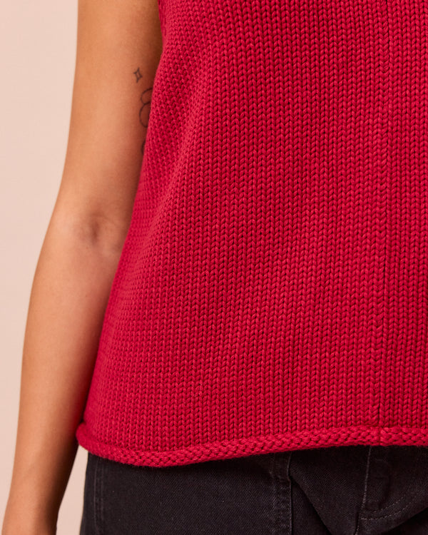 model wears vita cranberry knitted vest