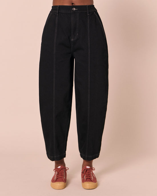model wears vivi black denim jeans