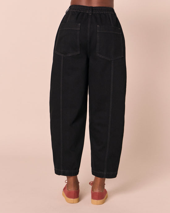 model wears vivi black denim jeans