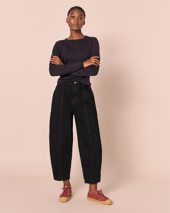 model wears vivi black denim jeans