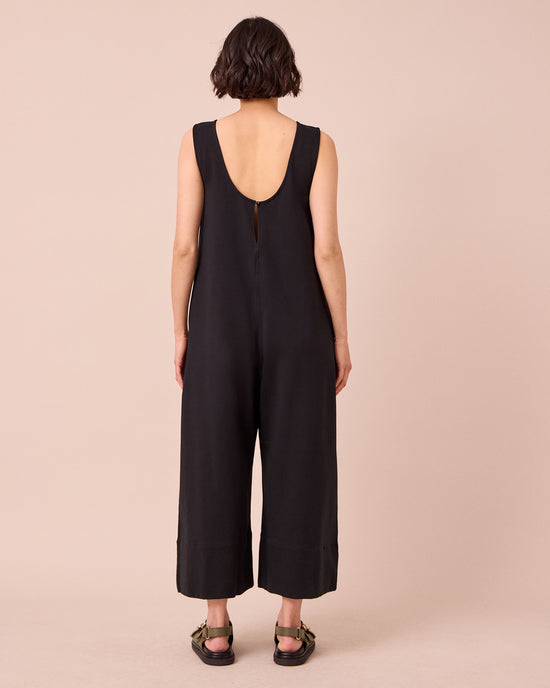 model wears vivienne black jersey jumpsuit