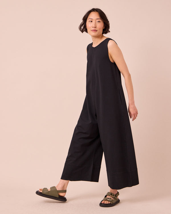 model wears vivienne black jersey jumpsuit