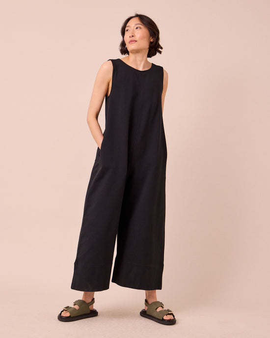 model wears vivienne black jersey jumpsuit