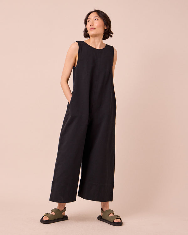 model wears vivienne black jersey jumpsuit
