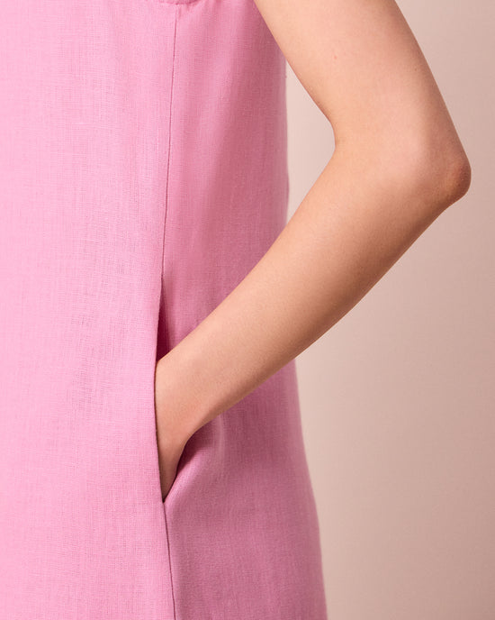 model wears vivienne rose pink linen jumpsuit