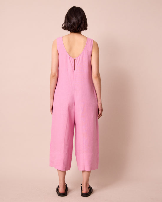 model wears vivienne rose pink linen jumpsuit