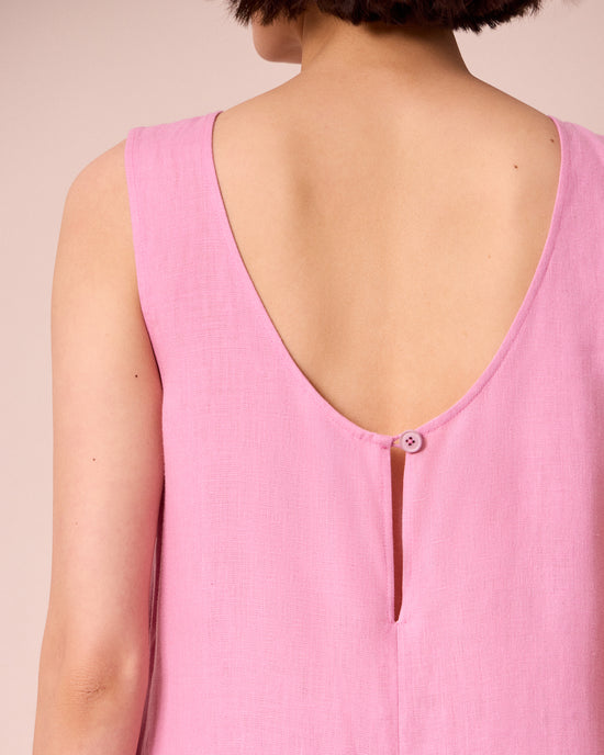 model wears vivienne rose pink linen jumpsuit