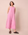 model wears vivienne rose pink linen jumpsuit