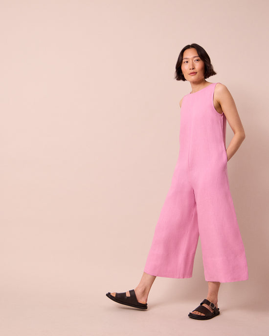 model wears vivienne rose pink linen jumpsuit
