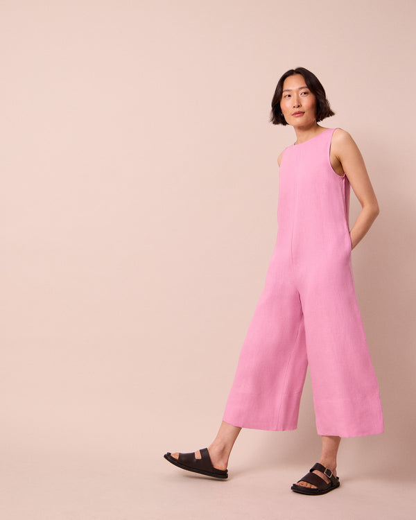 model wears vivienne rose pink linen jumpsuit