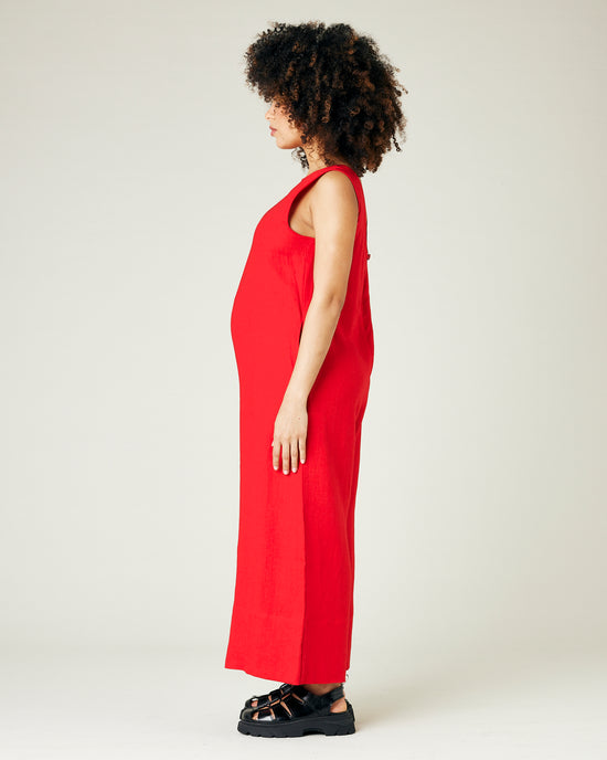 pregnant model wears red linen vivienne jumpsuit