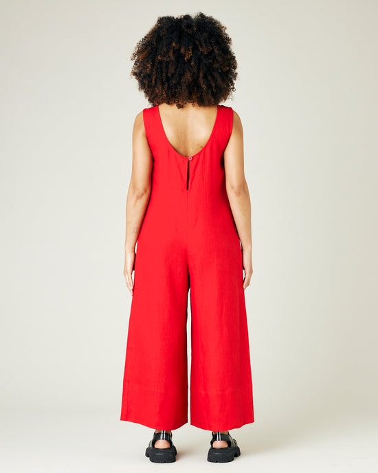 pregnant model wears red linen vivienne jumpsuit