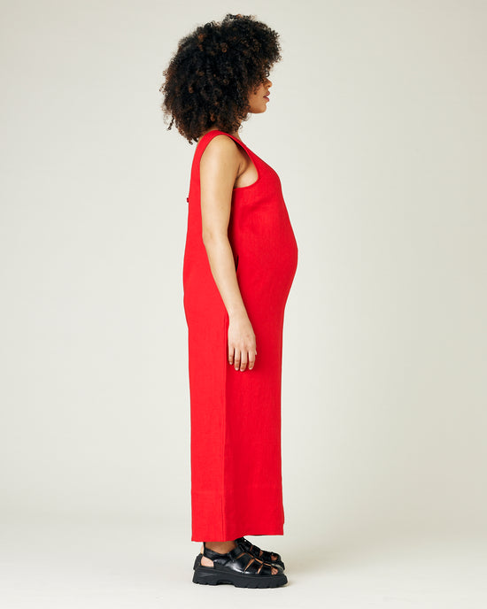 pregnant model wears red linen vivienne jumpsuit