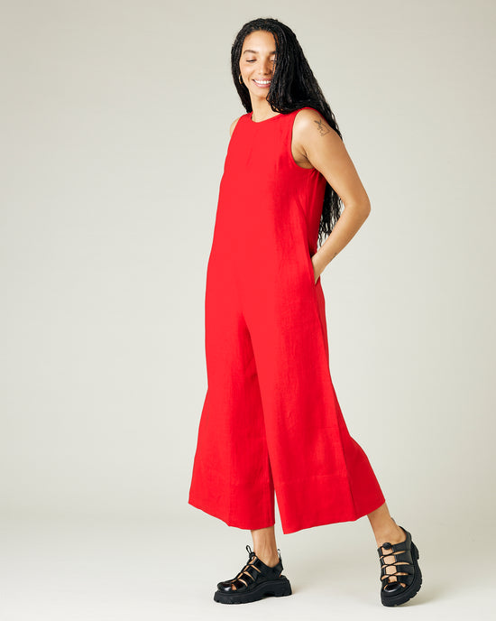 model wears red linen vivienne jumpsuit