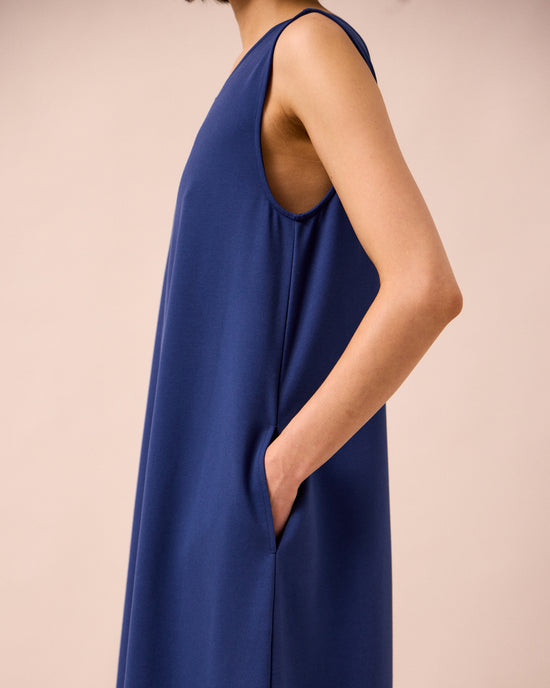 model wears vivienne french navy jersey jumpsuit