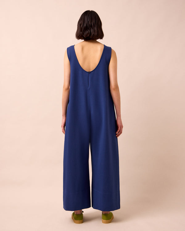 model wears vivienne french navy jersey jumpsuit