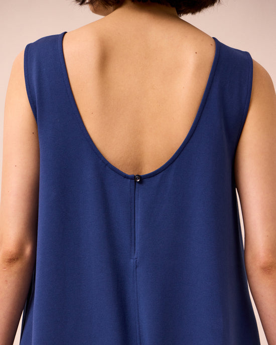 model wears vivienne french navy jersey jumpsuit