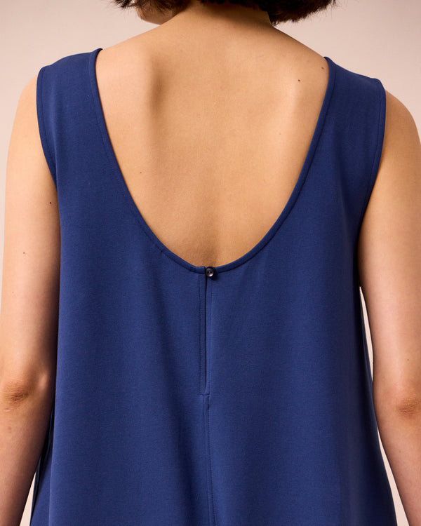 model wears vivienne french navy jersey jumpsuit