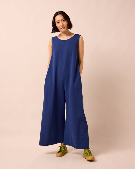 model wears vivienne french navy jersey jumpsuit