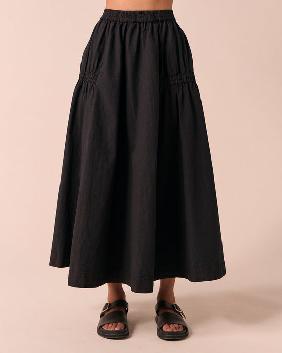 model wears willow black poplin skirt