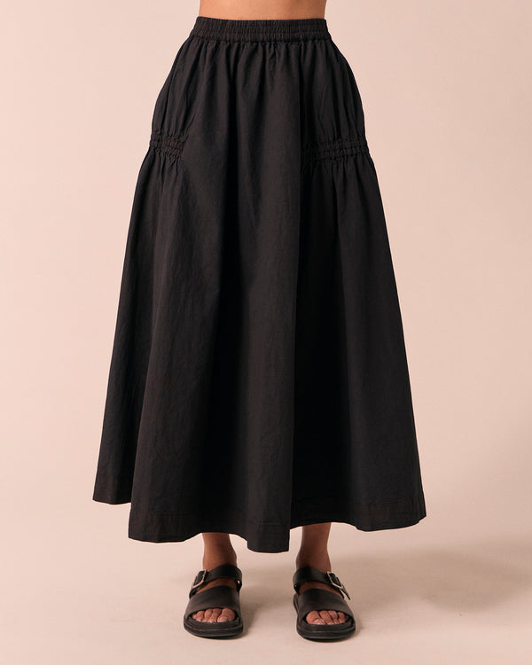 model wears willow black poplin skirt