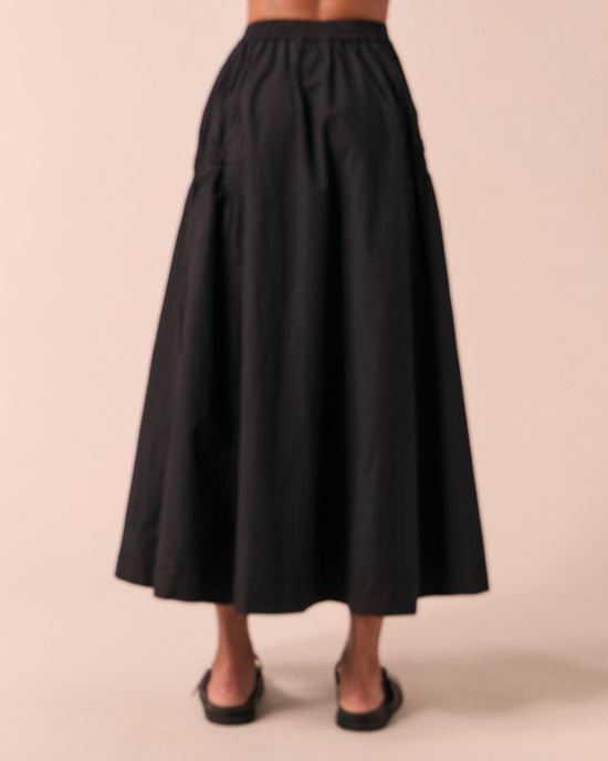 model wears willow black poplin skirt