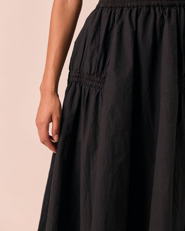 model wears willow black poplin skirt