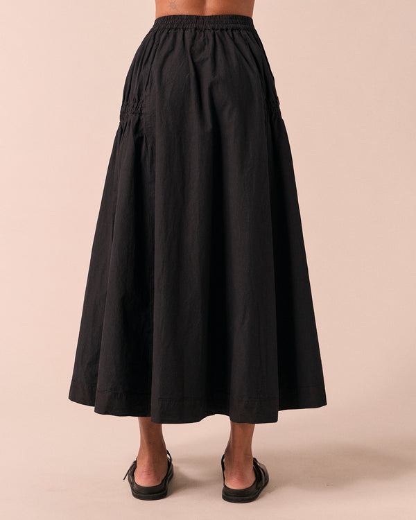 model wears willow black poplin skirt