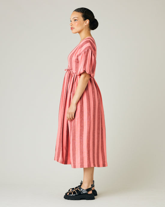 model wears blush stripe linen winnie dress