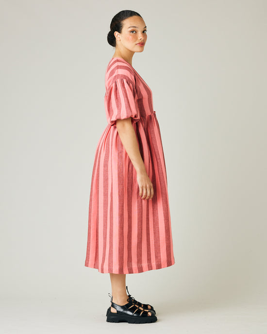 model wears blush stripe linen winnie dress