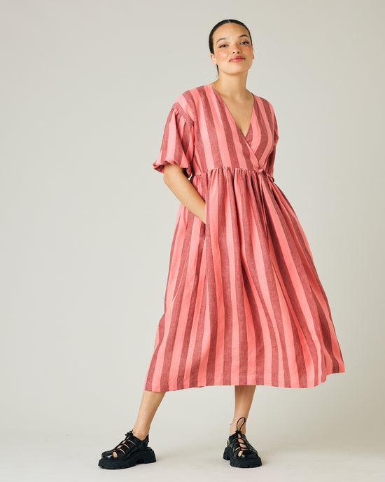 model wears blush stripe linen winnie dress