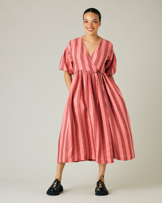 model wears blush stripe linen winnie dress