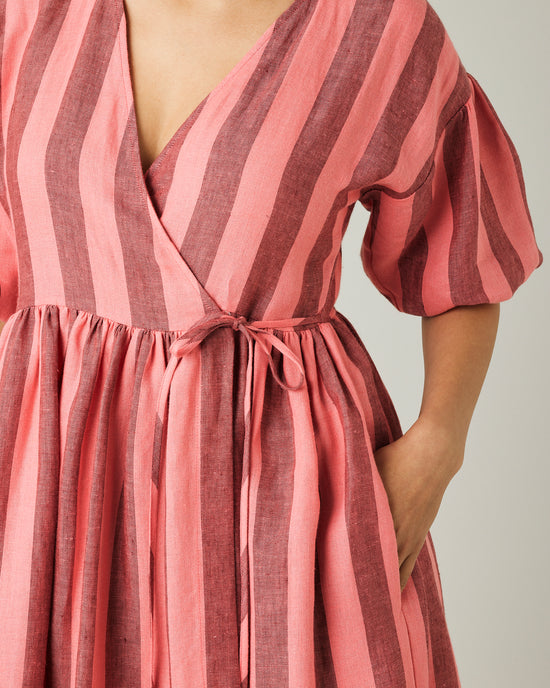 model wears blush stripe linen winnie dress